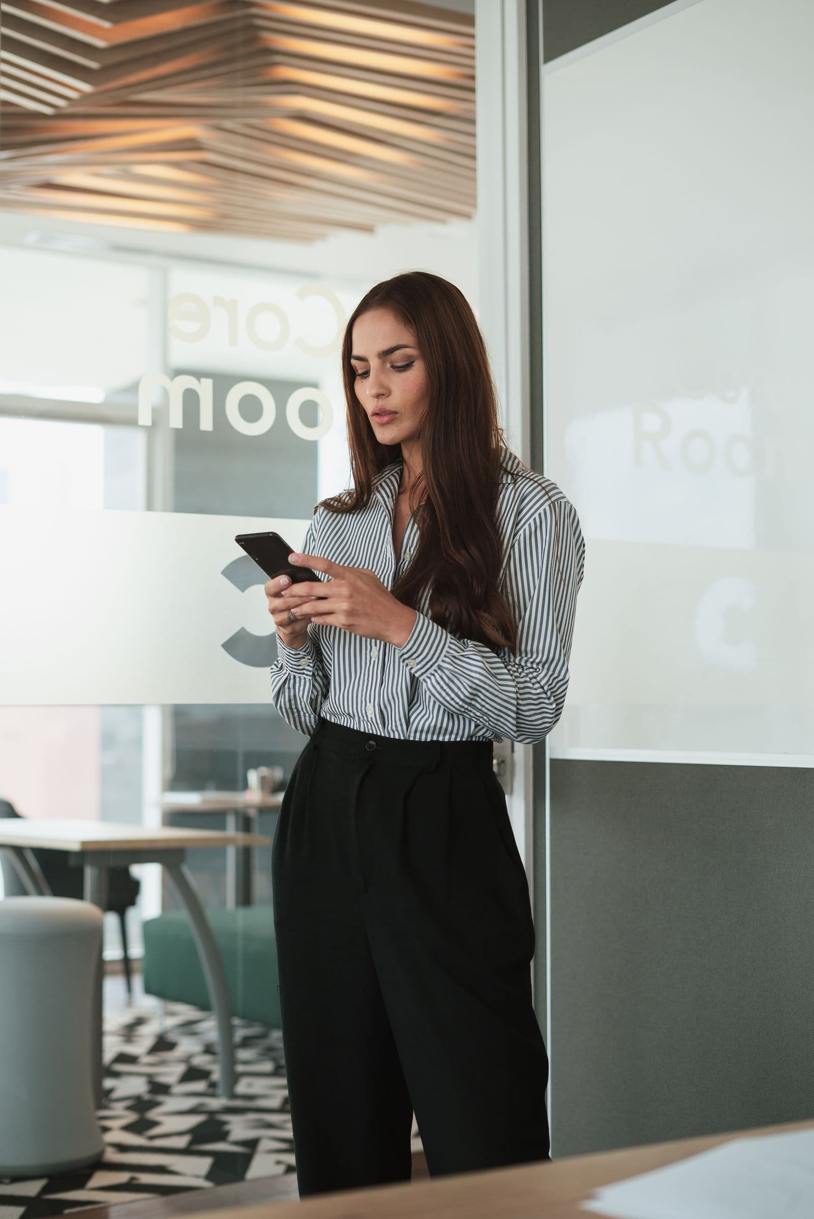 dating with a busy schedule, professional checking a phone between meetings